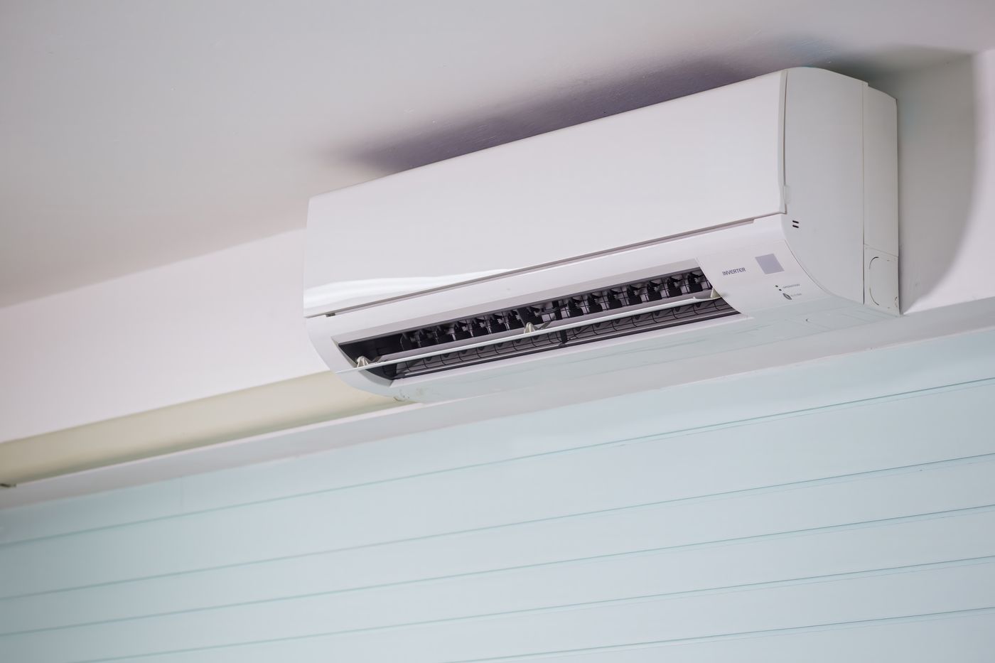 White wall-mounted ductless indoor unit with its air outlet open